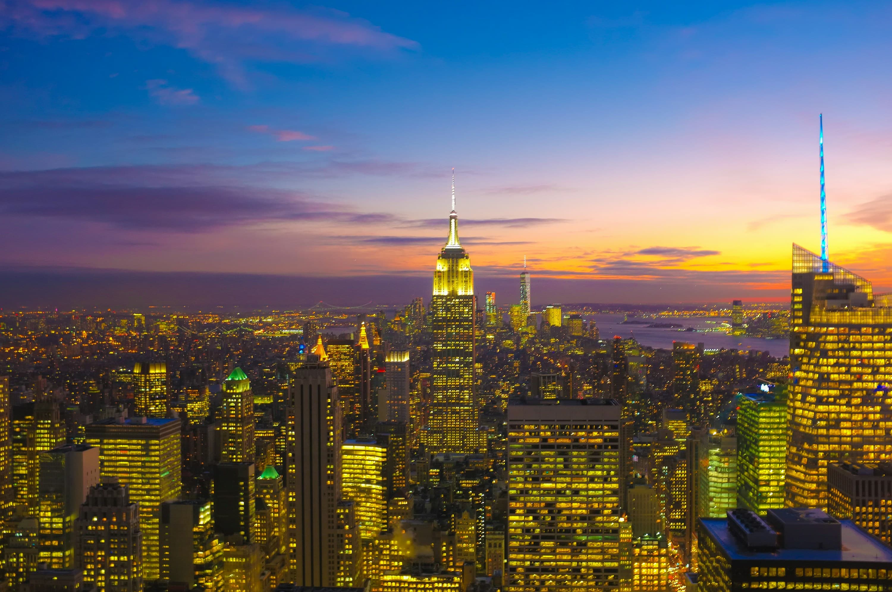 Manhattan skyline at dusk from a Brooklyn rooftop